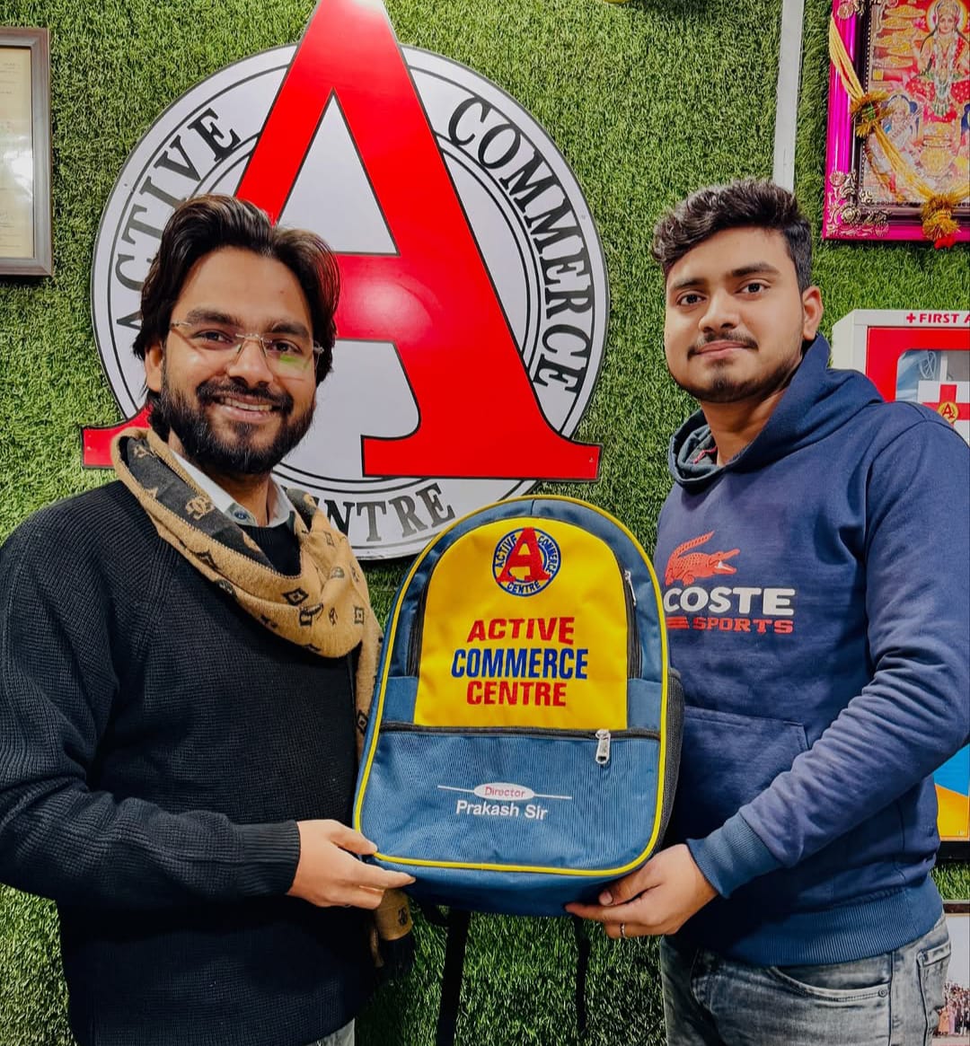 Director giving free bag to student